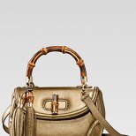 Малка златиста чанта с пискюли Gucci Есен-Зима 2011